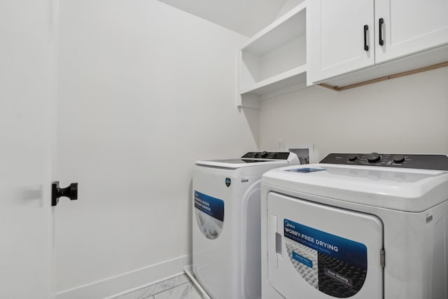 laundry area with cabinets and washer and dryer