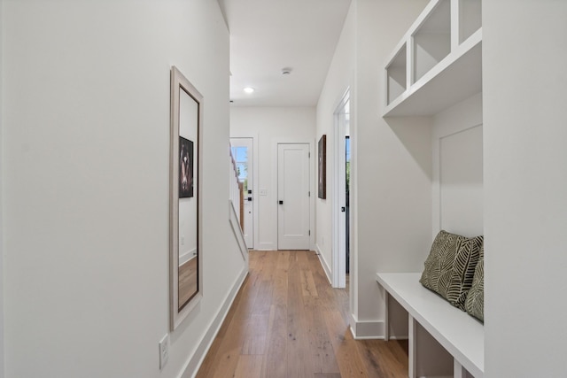 mudroom with light hardwood / wood-style floors