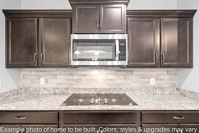 kitchen featuring tasteful backsplash, dark brown cabinets, and black electric cooktop