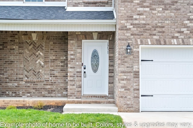 doorway to property with a garage