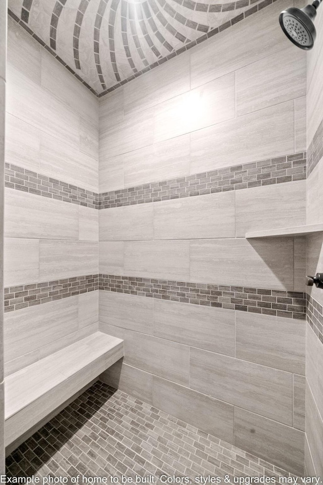 bathroom featuring tiled shower