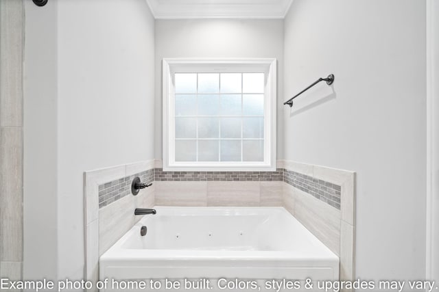 bathroom with ornamental molding and a bathing tub