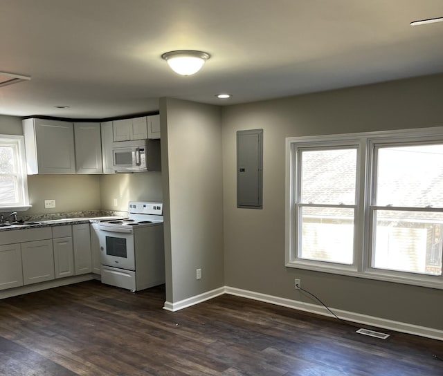 kitchen with white cabinetry, white appliances, electric panel, and dark hardwood / wood-style floors