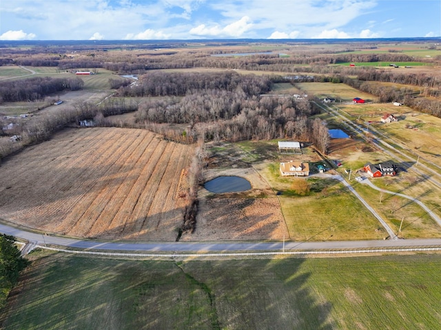 birds eye view of property with a rural view