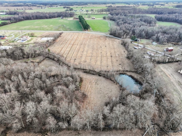 drone / aerial view featuring a water view and a rural view