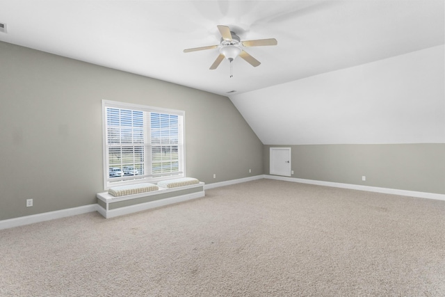 bonus room with lofted ceiling, carpet floors, and ceiling fan