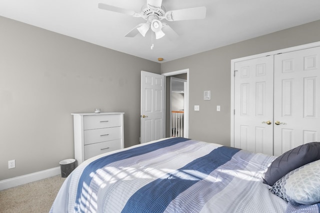 carpeted bedroom with a closet and ceiling fan