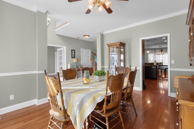 dining space featuring ornamental molding, hardwood / wood-style floors, and ceiling fan