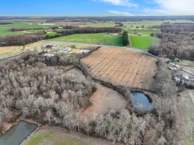 drone / aerial view featuring a rural view and a water view