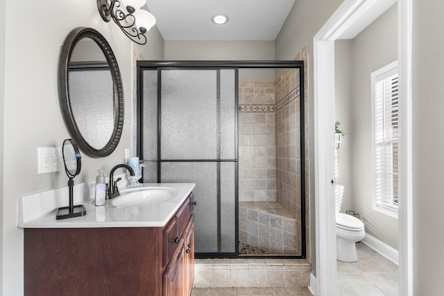 bathroom with walk in shower, a healthy amount of sunlight, and toilet