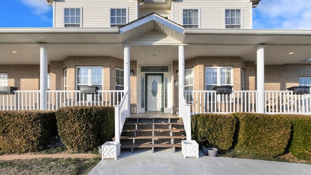 doorway to property featuring a porch