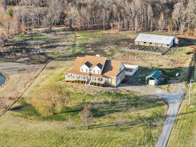 birds eye view of property featuring a rural view