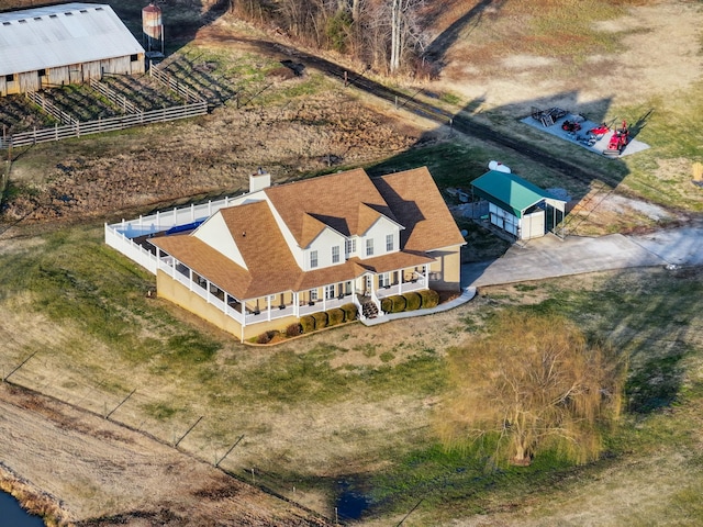 birds eye view of property featuring a rural view