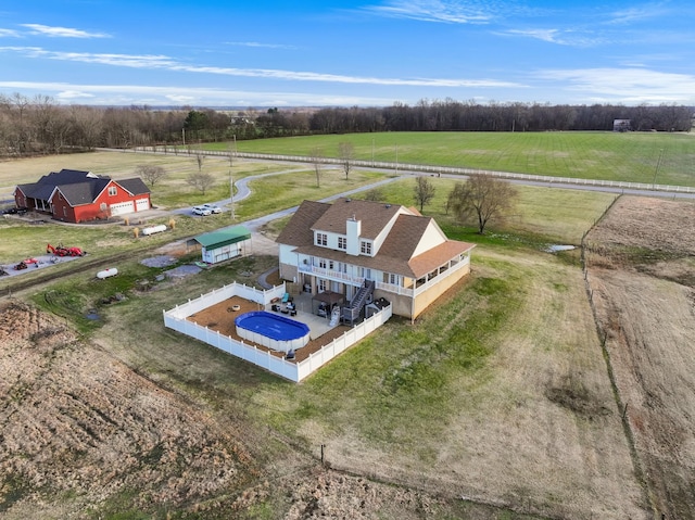 birds eye view of property featuring a rural view