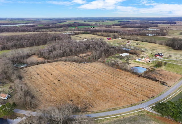 aerial view with a water view and a rural view