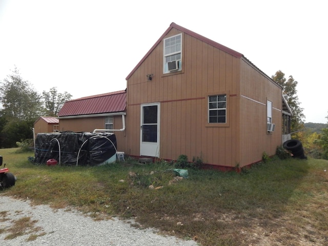 view of side of property with cooling unit