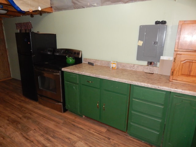 kitchen featuring electric stove, electric panel, dark hardwood / wood-style floors, and green cabinets