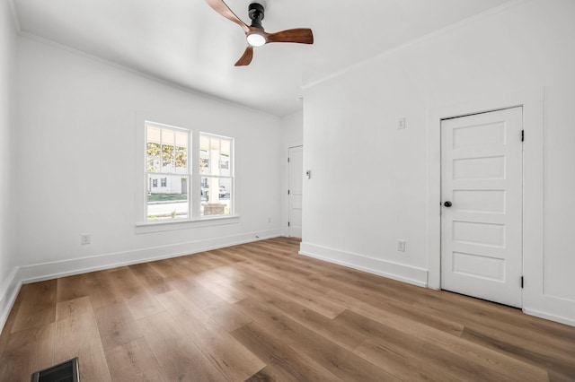 unfurnished room featuring crown molding, ceiling fan, and hardwood / wood-style floors