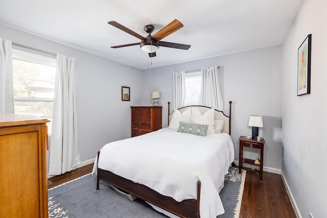 bedroom featuring ceiling fan and dark hardwood / wood-style flooring