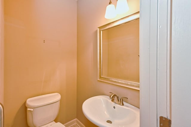 bathroom featuring sink and toilet