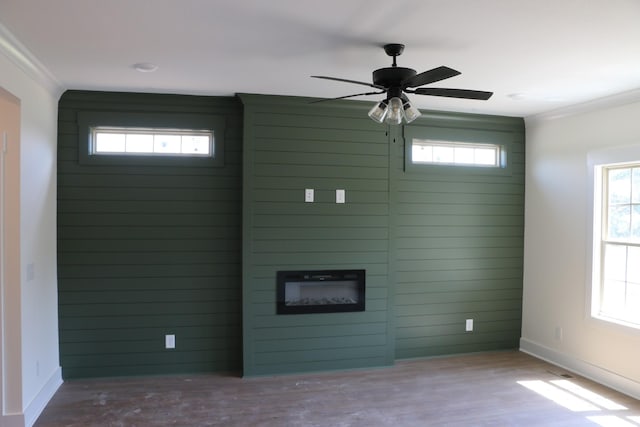 3 Charleston Cv, Clarksville, TN 37043 - unfurnished living room featuring wood finished floors, ceiling fan, a fireplace, and crown molding