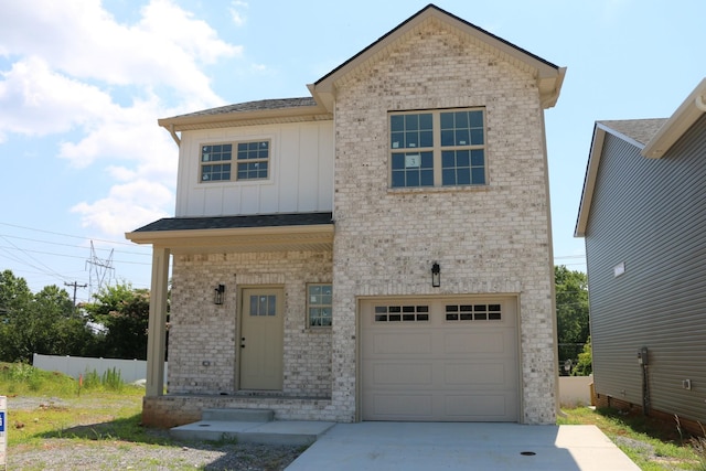 3 Charleston Cv, Clarksville, TN 37043 - view of front facade featuring board and batten siding, a garage, brick siding, and concrete driveway