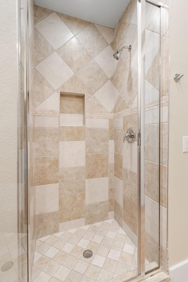 bathroom featuring an enclosed shower