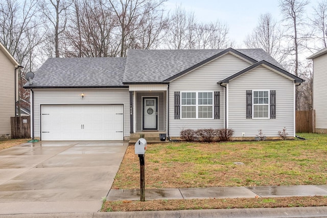 ranch-style home featuring a garage and a front yard