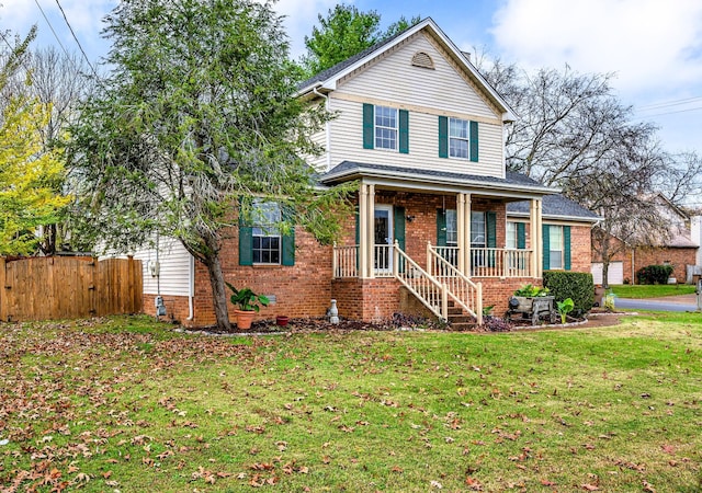 view of front of house featuring a porch and a front lawn