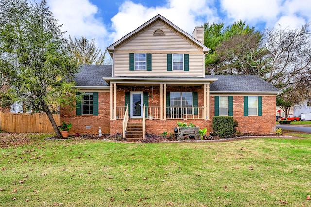 view of front property featuring a front yard and a porch