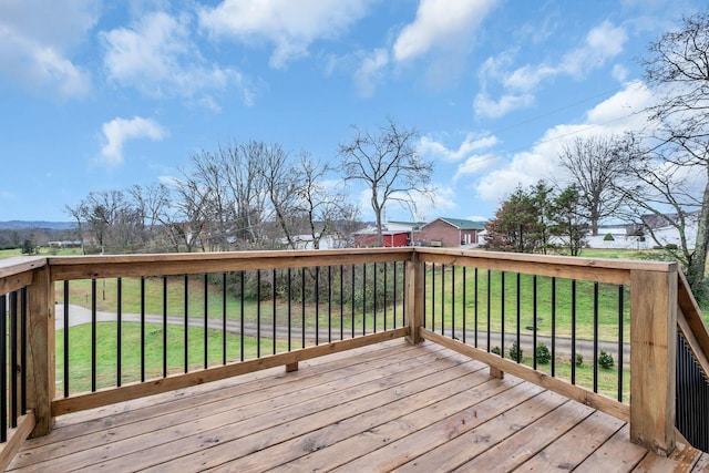 wooden terrace with a yard