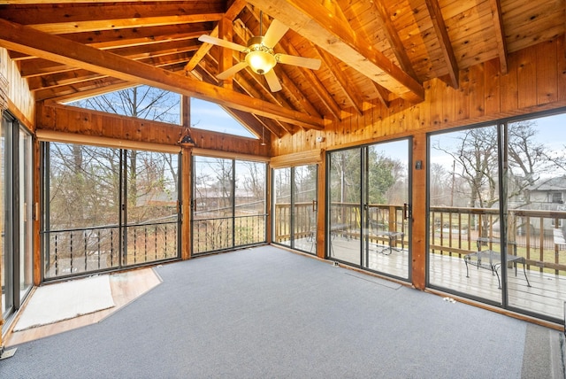 unfurnished sunroom featuring vaulted ceiling with beams, wood ceiling, and ceiling fan