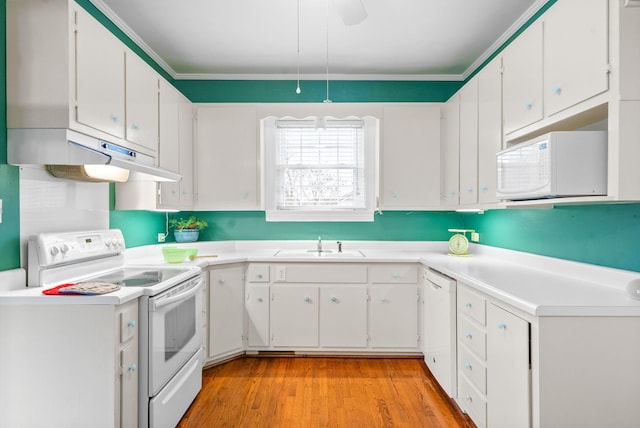 kitchen with white cabinetry, sink, white appliances, and light hardwood / wood-style flooring