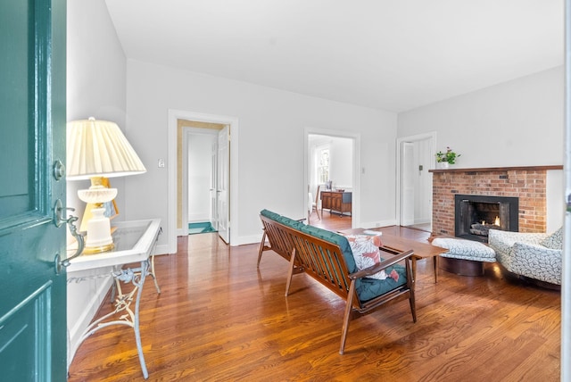 living room featuring hardwood / wood-style flooring and a fireplace