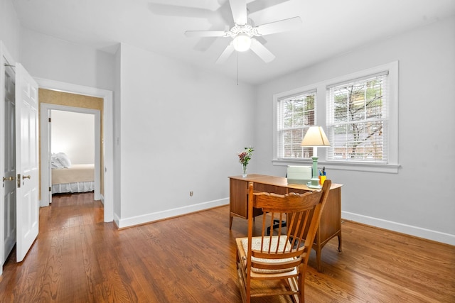 office featuring hardwood / wood-style flooring and ceiling fan