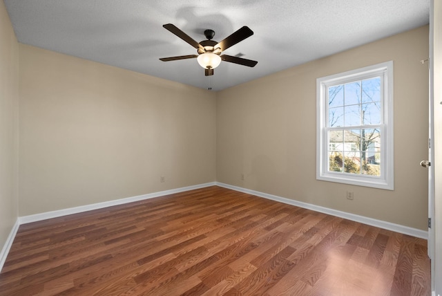 unfurnished room featuring hardwood / wood-style floors and ceiling fan