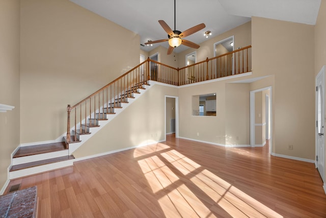 unfurnished living room with ceiling fan and light hardwood / wood-style flooring