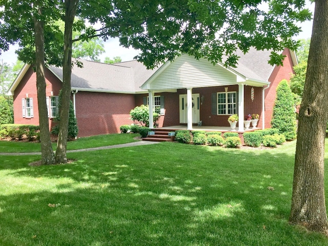 single story home featuring covered porch and a front lawn