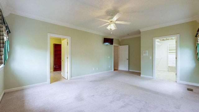 unfurnished bedroom featuring crown molding, connected bathroom, and light carpet