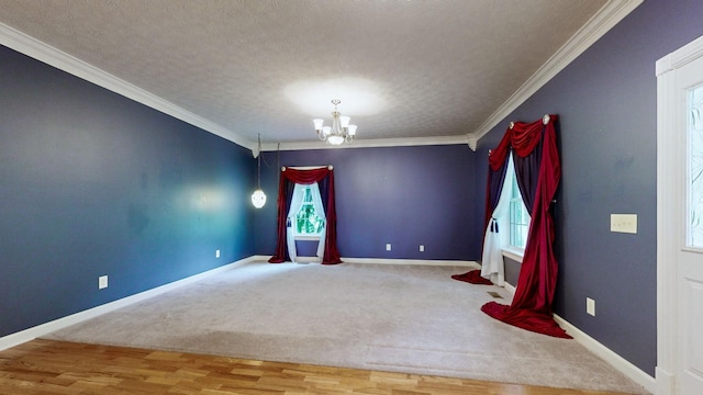spare room featuring a healthy amount of sunlight, a chandelier, and baseboards