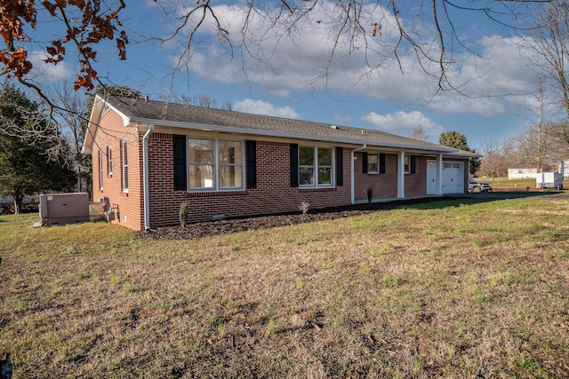 ranch-style home with a garage and a front yard