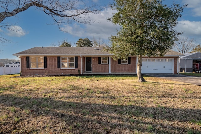 single story home featuring a garage and a front yard