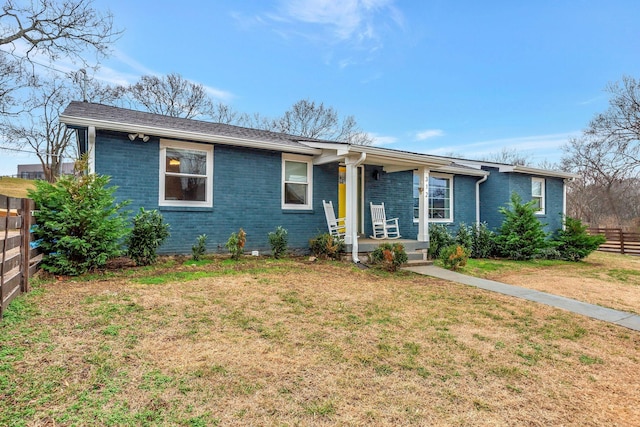 ranch-style house with a front lawn