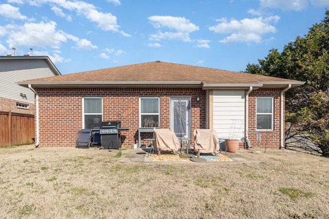 back of house with a yard and a patio area