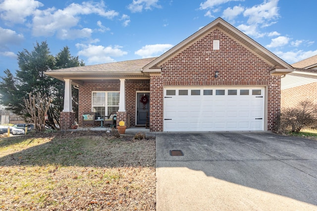 view of front facade featuring a garage and a porch