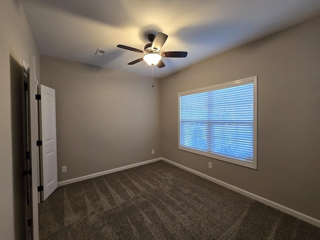 carpeted empty room with ceiling fan