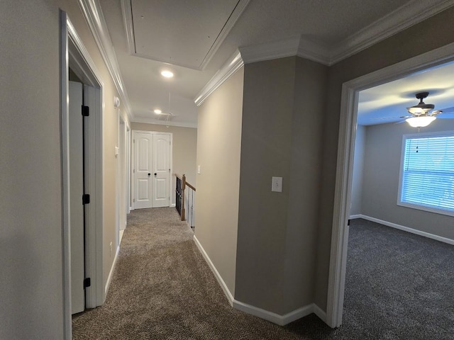 hall featuring ornamental molding and dark carpet