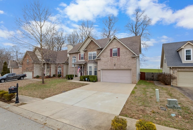 view of front of property featuring a garage and a front lawn