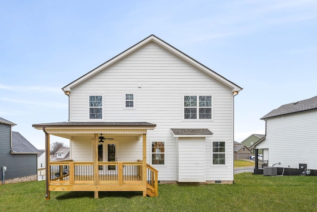 rear view of property with a yard, a deck, ceiling fan, and central air condition unit