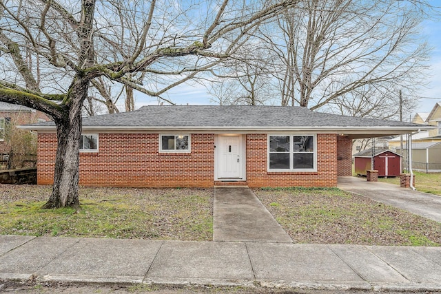 single story home with a carport and a storage shed